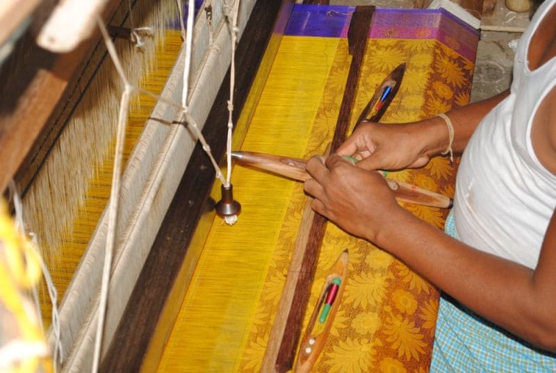 Handloom Weaver weaving a Saree