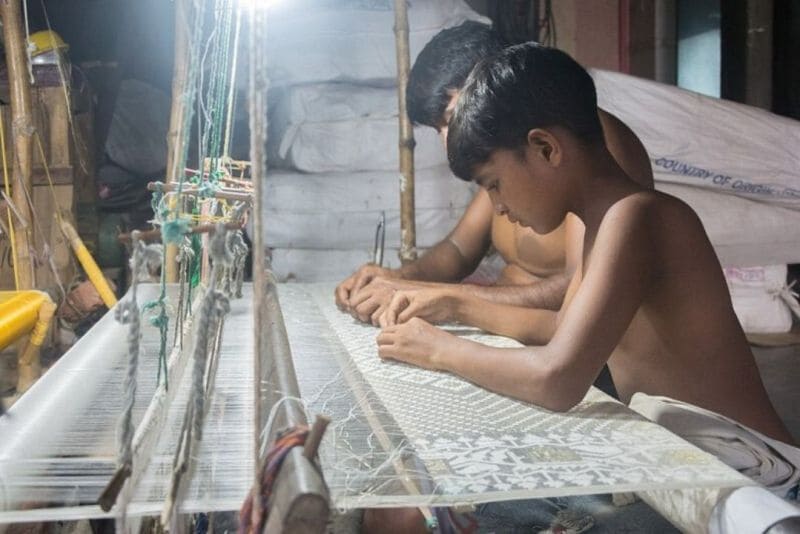 Hardworking Weavers making a Jamdani Saree on a Handloom